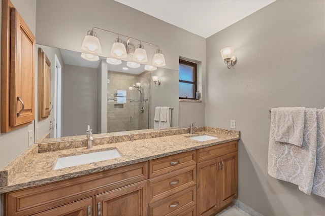 bathroom with vanity and a shower with door