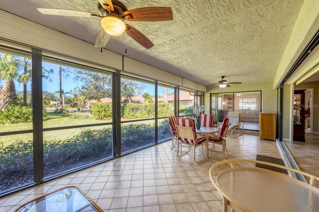 sunroom / solarium with ceiling fan