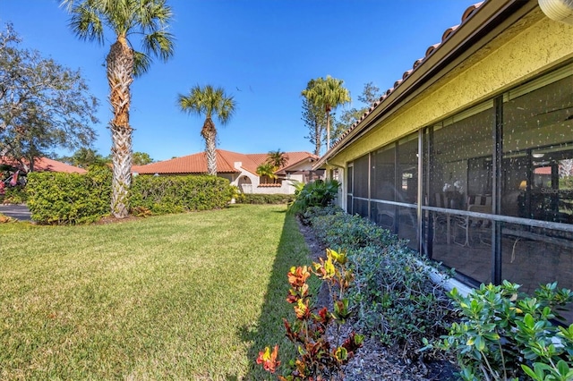 view of yard with a sunroom