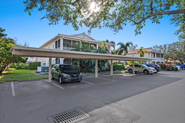 view of parking / parking lot with a carport