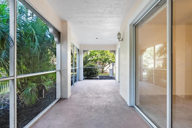 unfurnished sunroom featuring a wealth of natural light