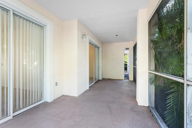 hallway featuring light carpet