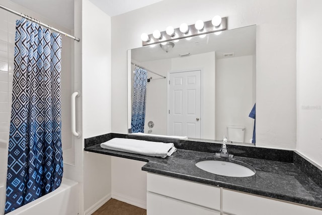 full bathroom featuring shower / bath combination with curtain, vanity, toilet, and tile patterned floors