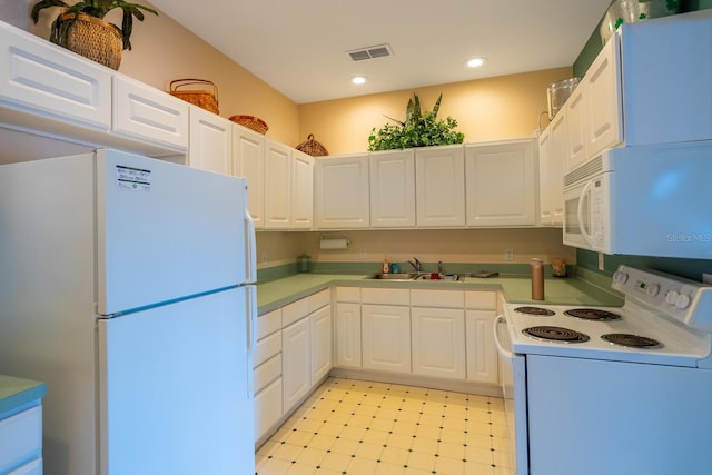 kitchen featuring white cabinets, white appliances, and sink