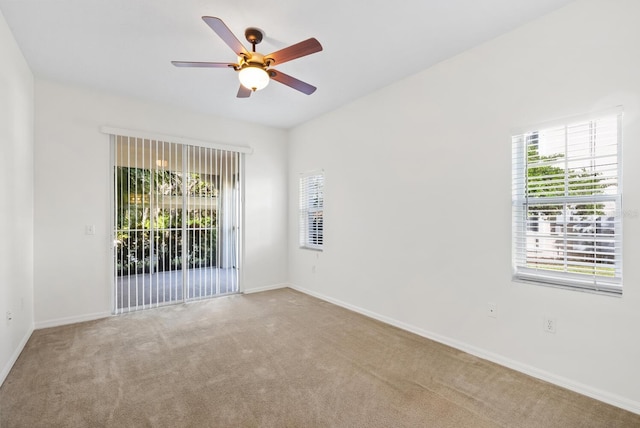 spare room with carpet flooring and ceiling fan