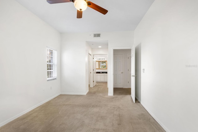 carpeted empty room with ceiling fan