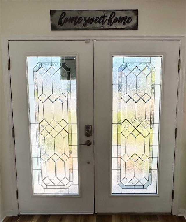 interior details featuring french doors and hardwood / wood-style floors