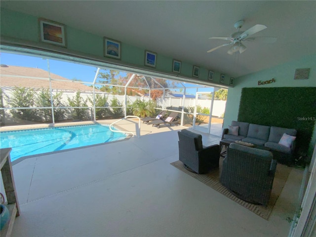 view of pool featuring ceiling fan and a mountain view