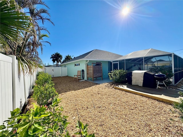 back of house with a lanai