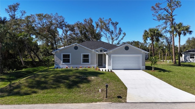 view of front of property featuring a front lawn and a garage