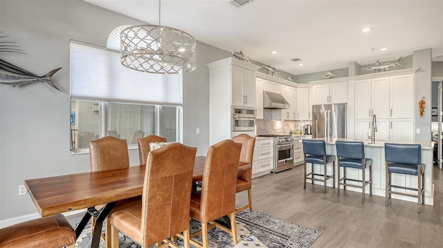 dining space featuring light hardwood / wood-style flooring