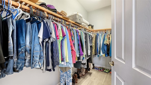 spacious closet featuring hardwood / wood-style flooring