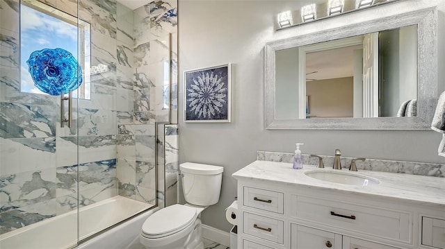 full bathroom with vanity, toilet, and shower / bath combination with glass door