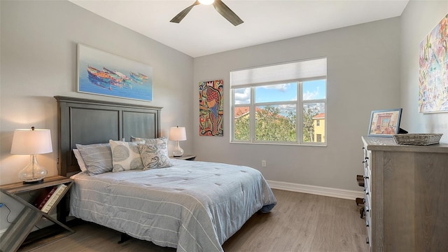 bedroom featuring light hardwood / wood-style flooring and ceiling fan