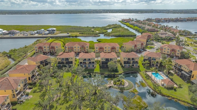 birds eye view of property with a water view