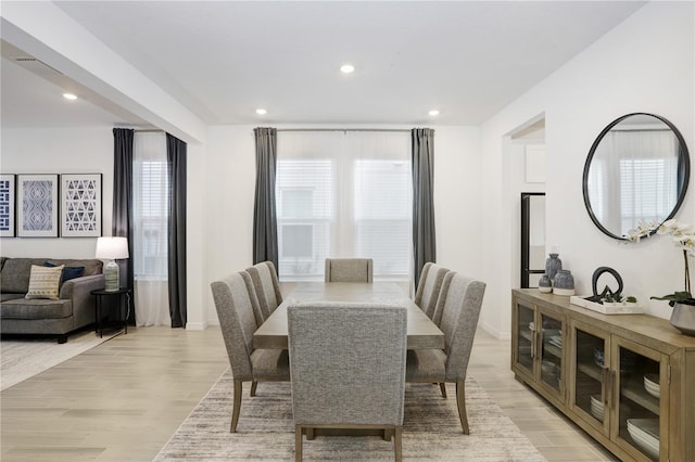 dining space with light hardwood / wood-style flooring