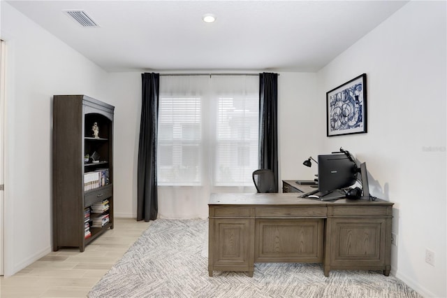 office area with light hardwood / wood-style flooring