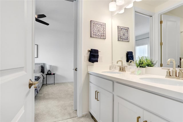 bathroom with ceiling fan and vanity