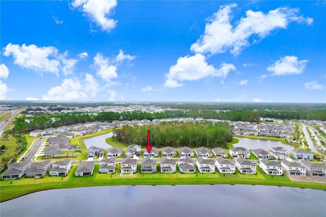 drone / aerial view with a water view