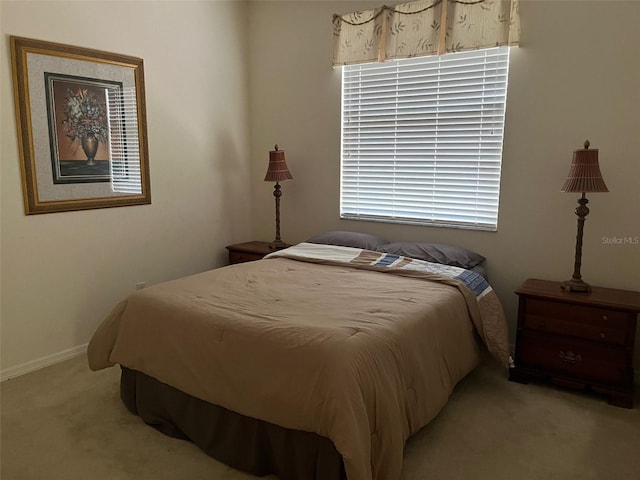 bedroom with light colored carpet