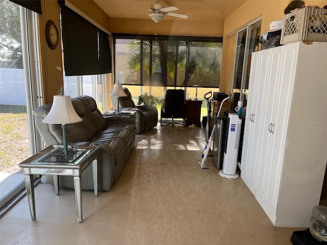 sunroom featuring ceiling fan