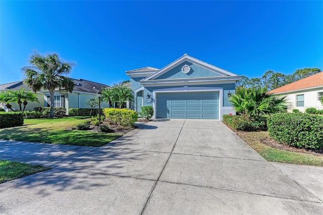 1387 Still River Dr, Venice, FL 34293 - single story home featuring concrete driveway, an attached garage, stucco siding, and a front yard