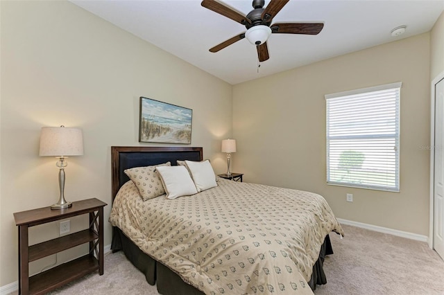 carpeted bedroom with ceiling fan