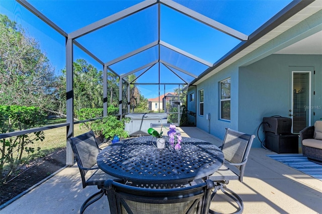 view of patio featuring a lanai and a hot tub