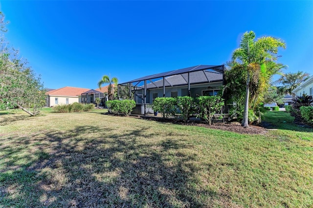 1387 Still River Dr, Venice, FL 34293 - view of grassy yard with glass enclosure