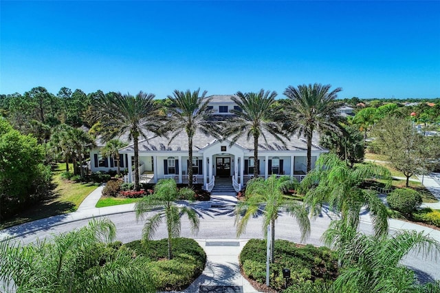 1387 Still River Dr, Venice, FL 34293 - view of front of house with a porch and stucco siding