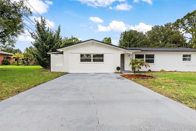 ranch-style house with a front lawn