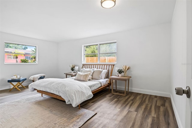 bedroom featuring dark wood-type flooring