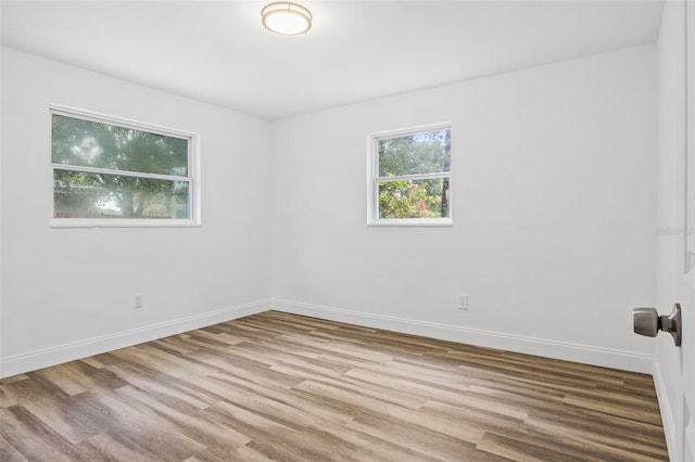 unfurnished room featuring light wood-type flooring