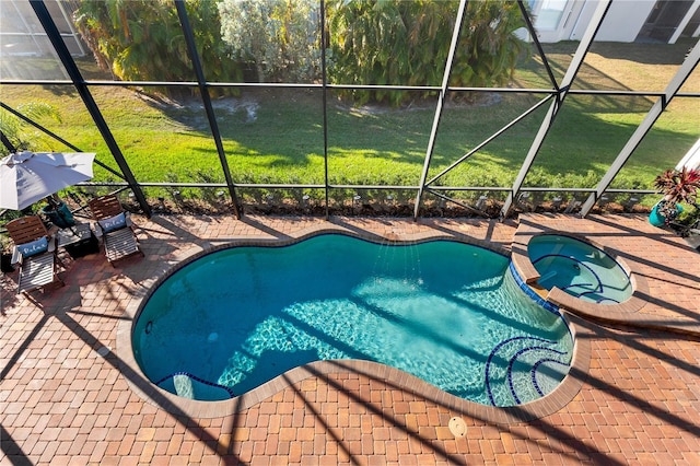 view of pool with an in ground hot tub, a lanai, and a patio