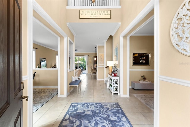 tiled foyer with ornamental molding