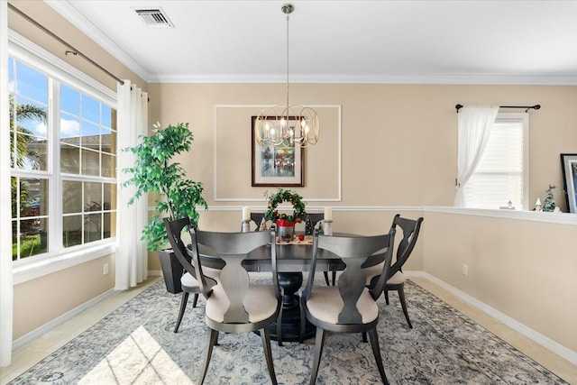 tiled dining space featuring crown molding and an inviting chandelier