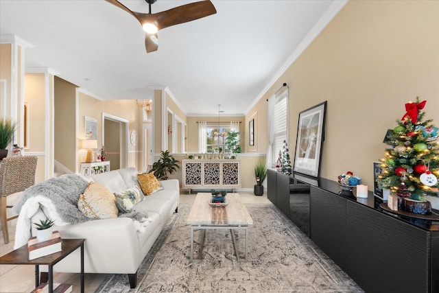 living room with ornamental molding and a chandelier