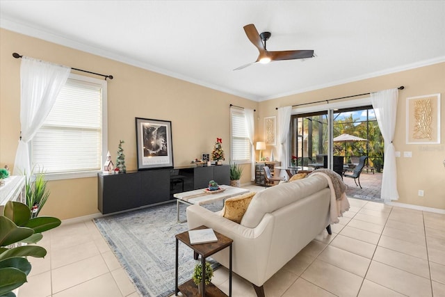 living room featuring light tile patterned flooring, ceiling fan, and ornamental molding