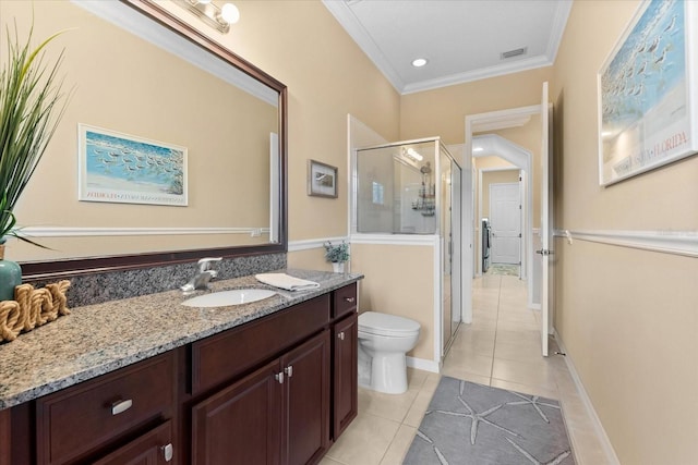 bathroom featuring toilet, an enclosed shower, ornamental molding, vanity, and tile patterned flooring