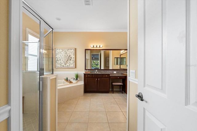 bathroom featuring ornamental molding, tile patterned floors, plus walk in shower, and vanity