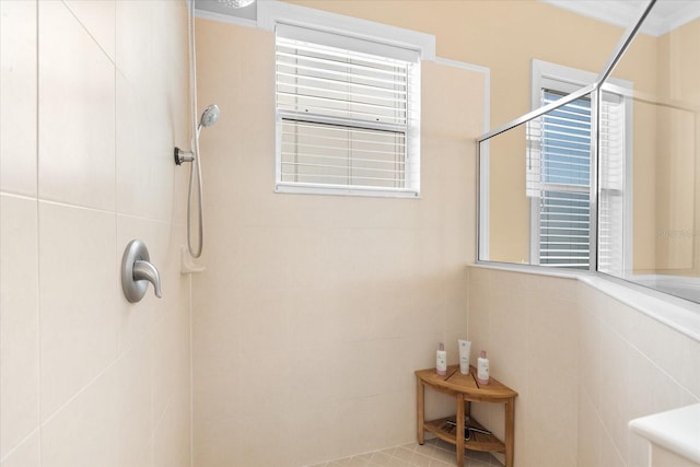 bathroom with a tile shower