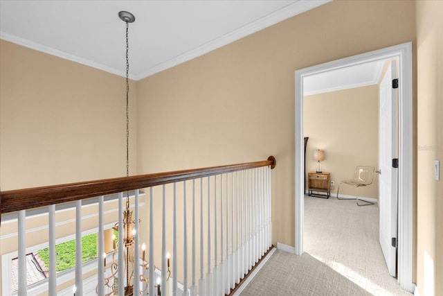 corridor featuring ornamental molding and light colored carpet