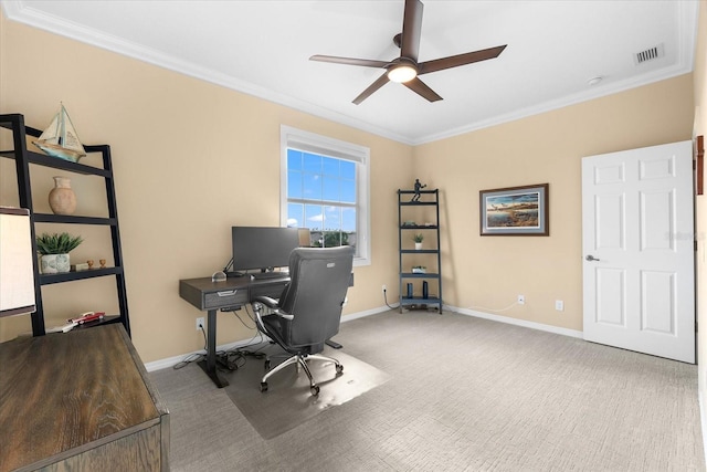 carpeted home office with ceiling fan and ornamental molding