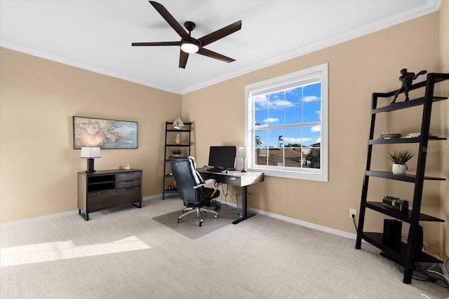 carpeted office space featuring crown molding and ceiling fan