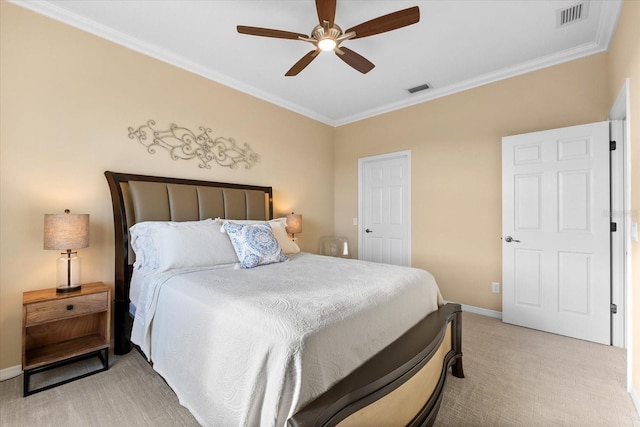 carpeted bedroom with crown molding and ceiling fan