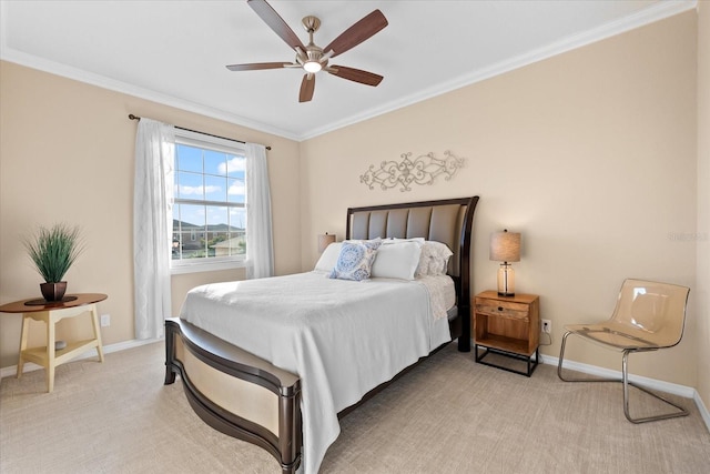 carpeted bedroom with ornamental molding and ceiling fan