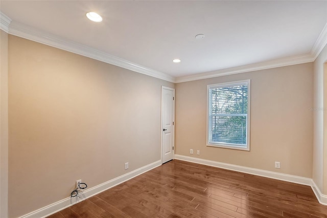 unfurnished room with hardwood / wood-style floors and ornamental molding