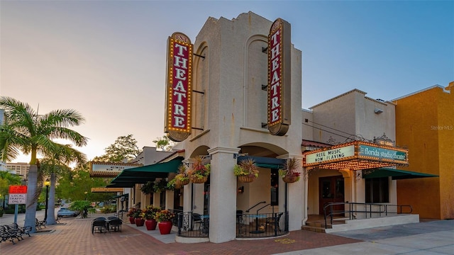 view of outdoor building at dusk