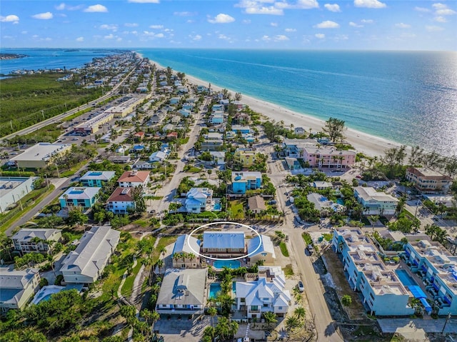 aerial view featuring a water view and a view of the beach