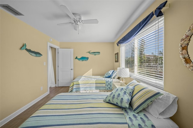 bedroom featuring hardwood / wood-style floors and ceiling fan